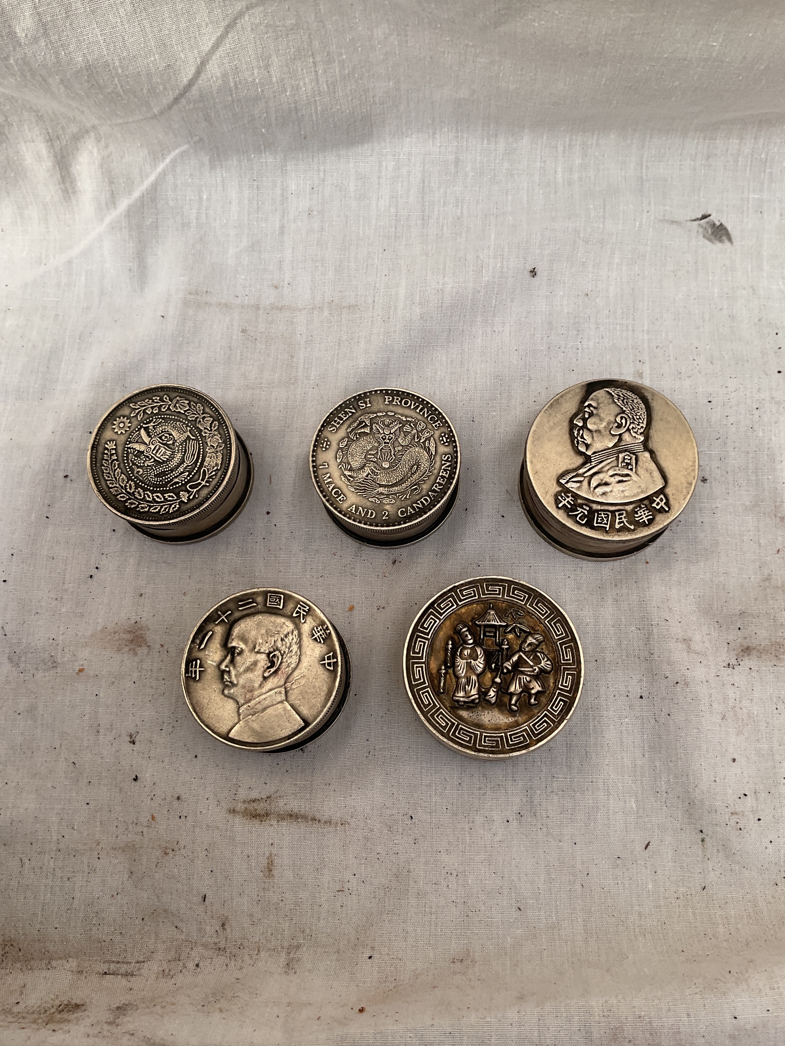Chinese white metal coin topped metal pots with stamps to the base.