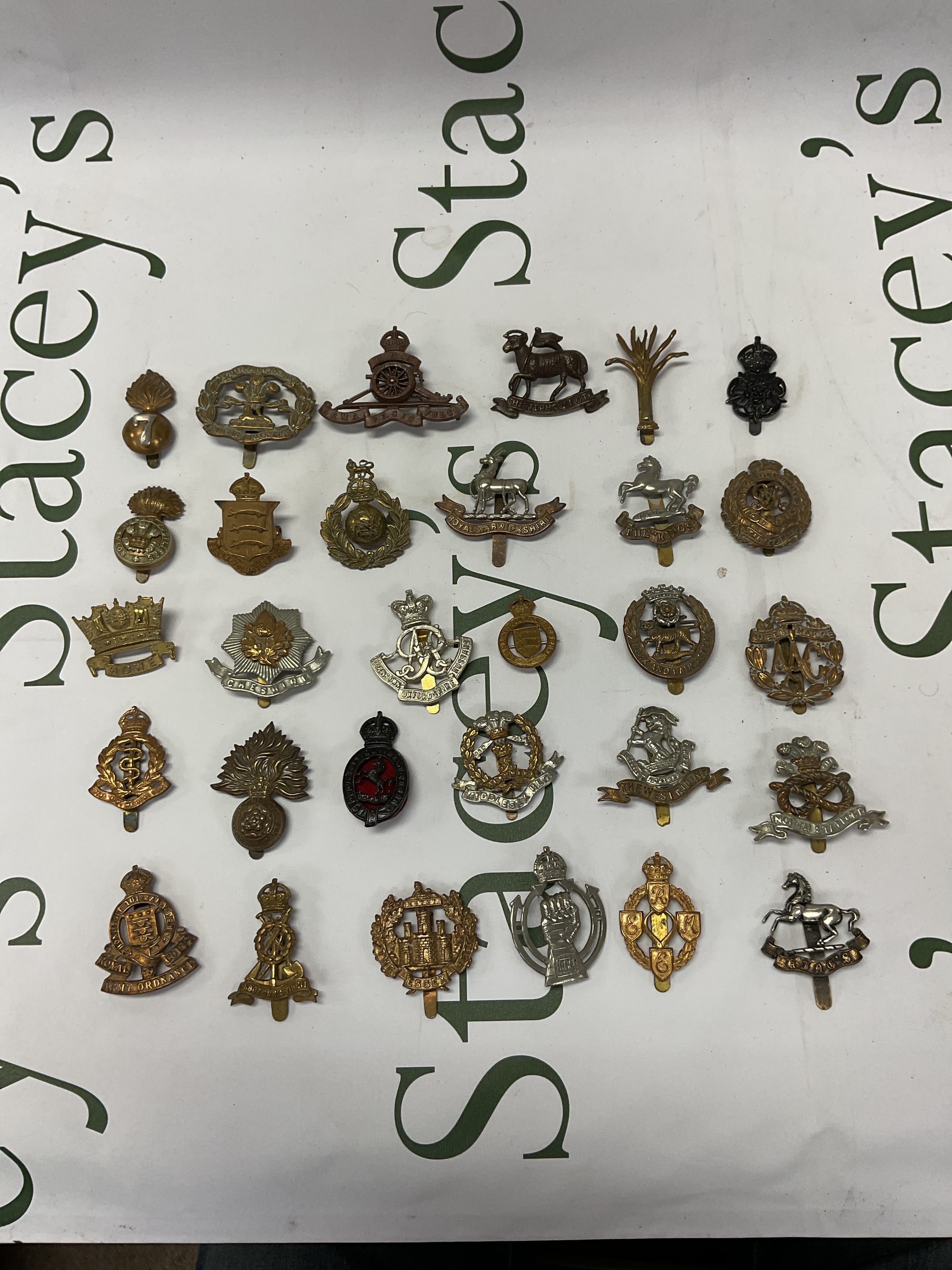 Qty of Military Cap badges.