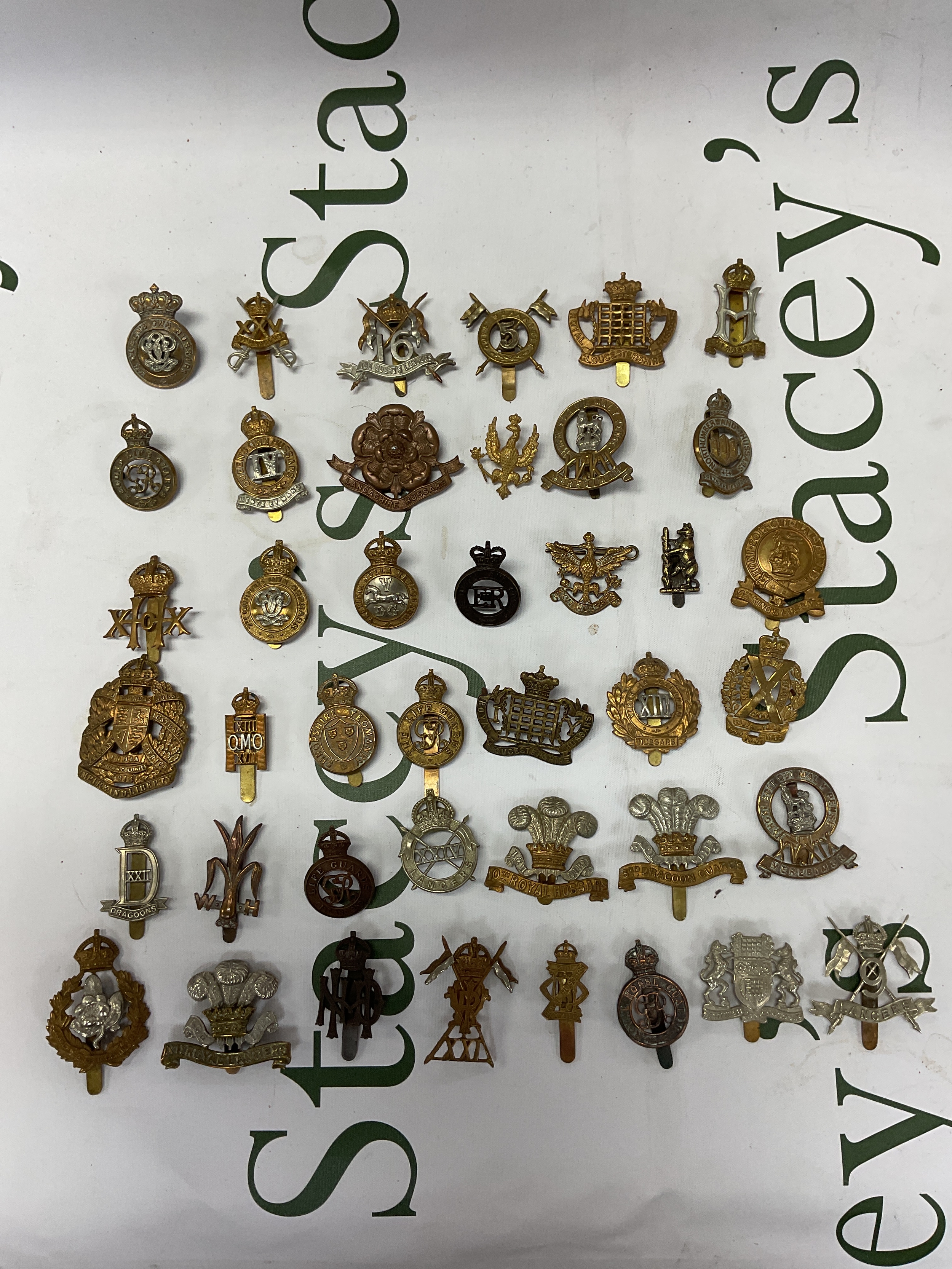 Qty of Hussar, Dragoon, lancer and horse Regt badges.