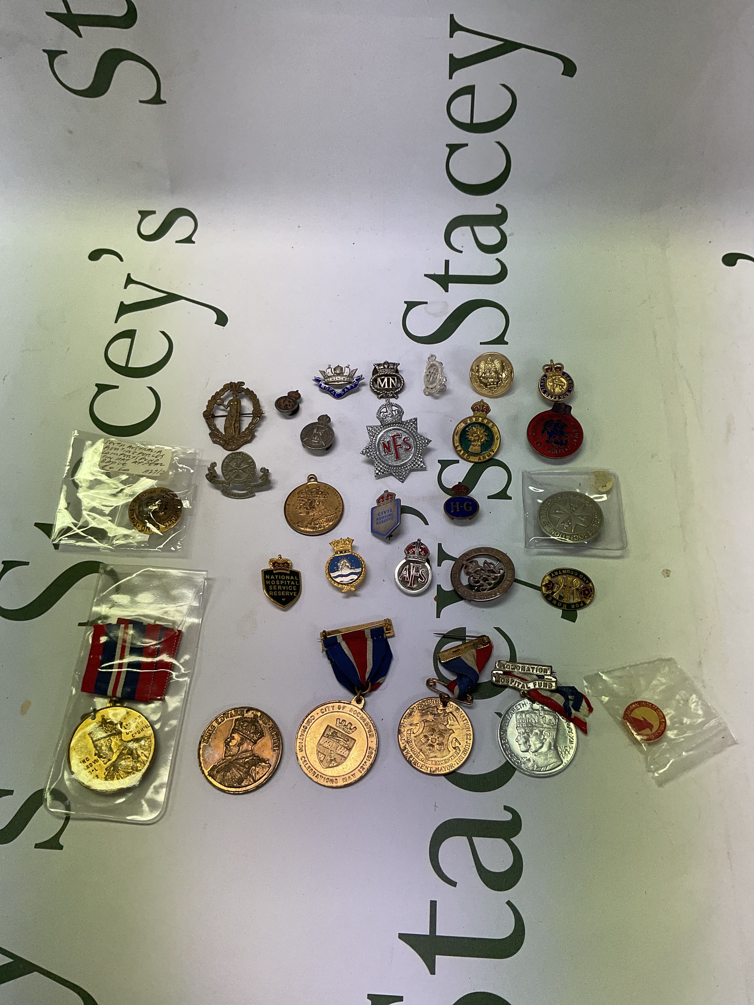 Military badges, lapel buttons, medals etc.