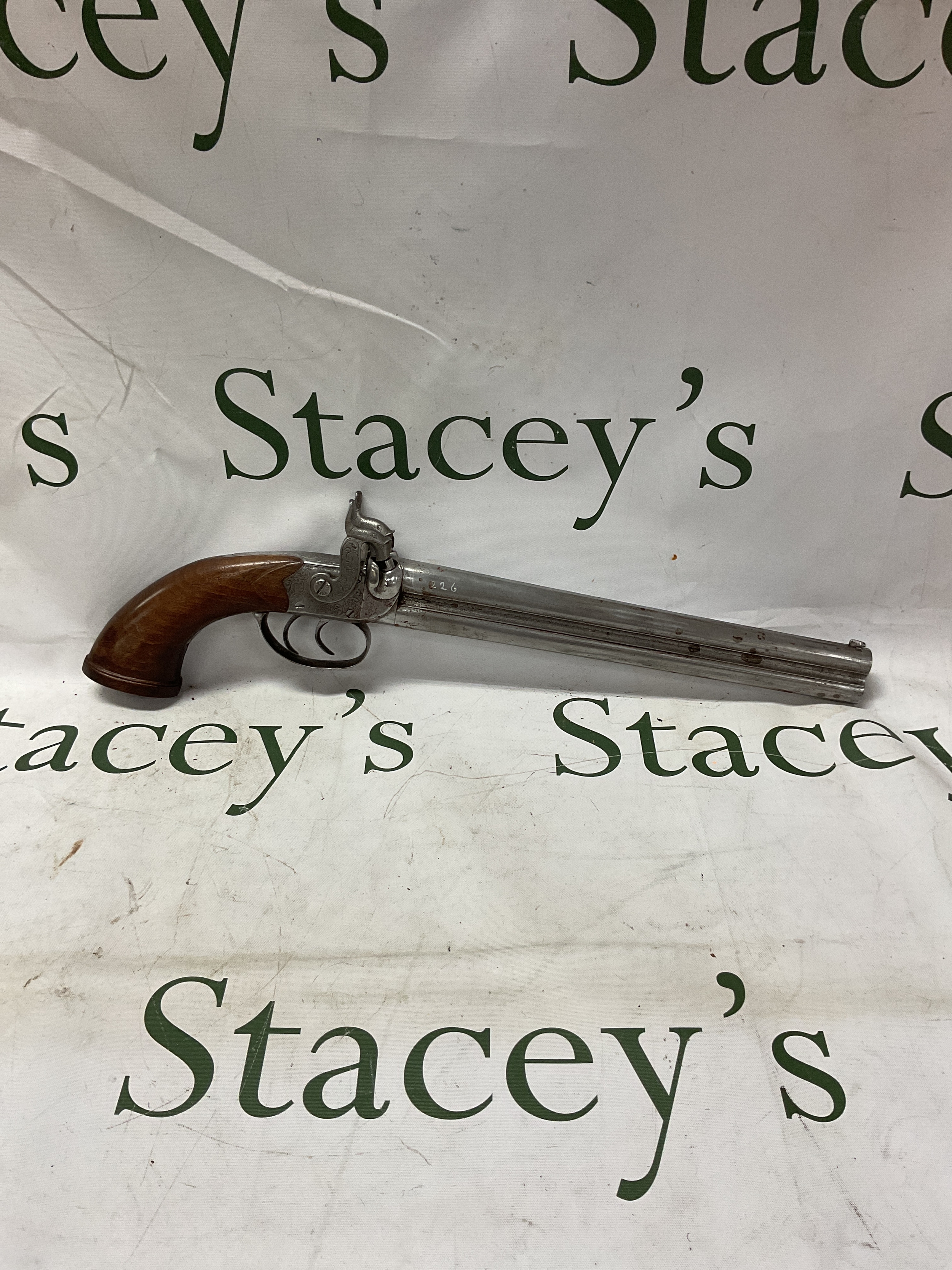 Large bore double barrelled percussion pistol, set with two Dolphin formed hammers, barrel length 26cm.