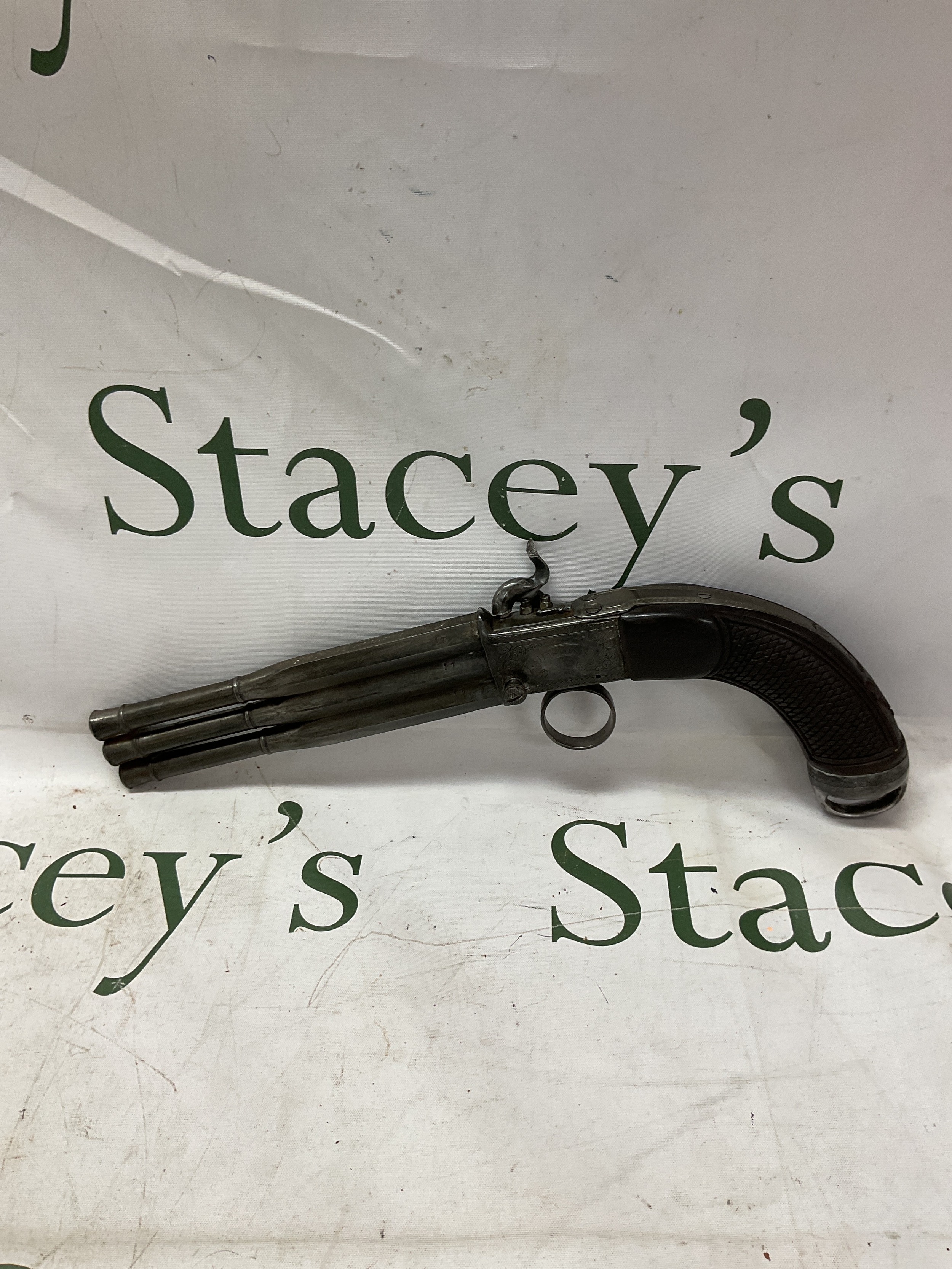 J Harding London three barrelled percussion pistol, one trigger firing on three different nipples on the ring pull trigger. Barrel length 18cm.