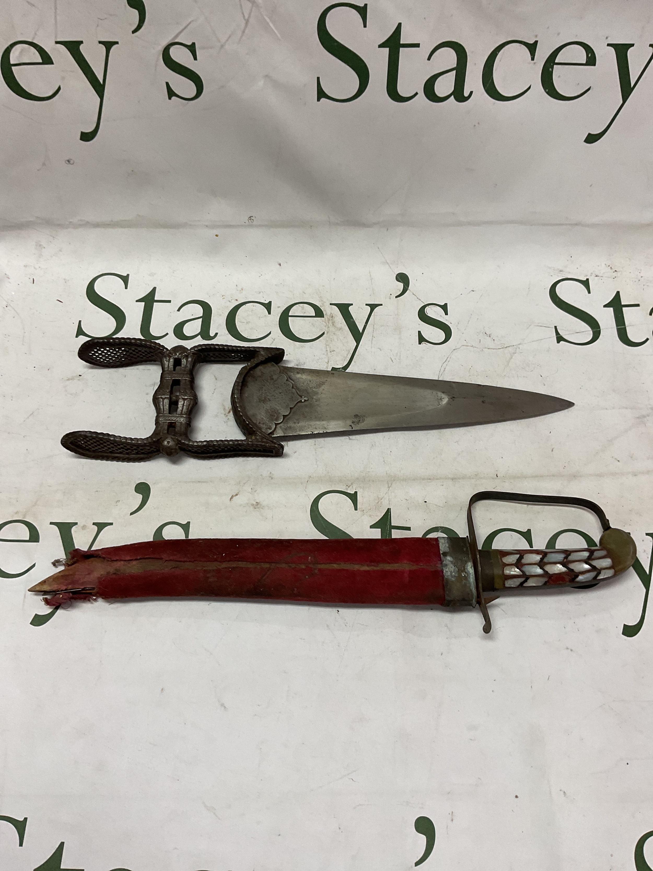 19th C Indian push dagger, pierced decorated handle with floral finials, very sharp blade of diamond cross section 36 cm. Along with a later souvenir example.