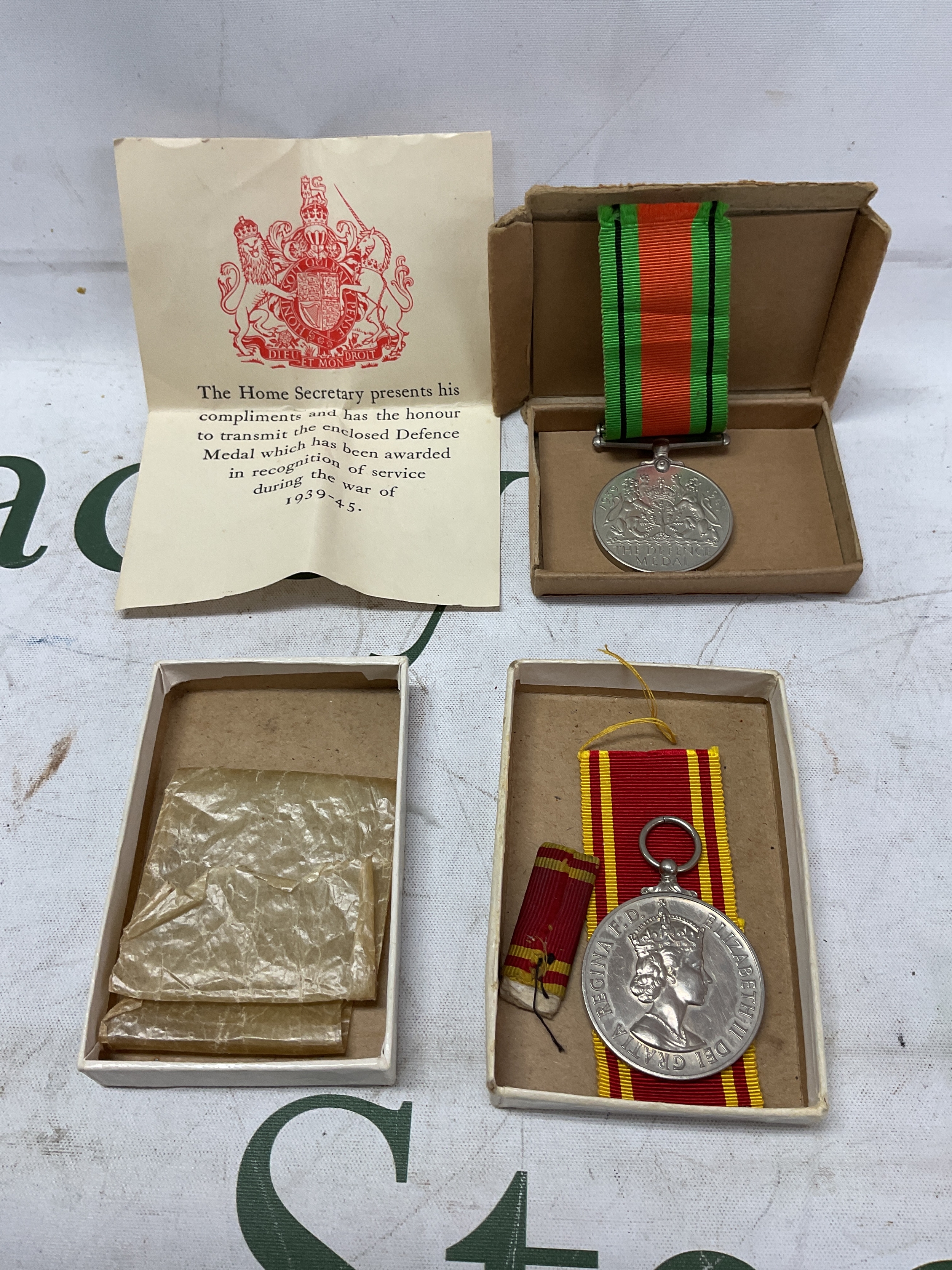 WWIi cased Defence Medal and ribbon and cert, along with QEIIR issued Exemplary Fire Service medal for long service named to ldg fireman Joseph Owers.