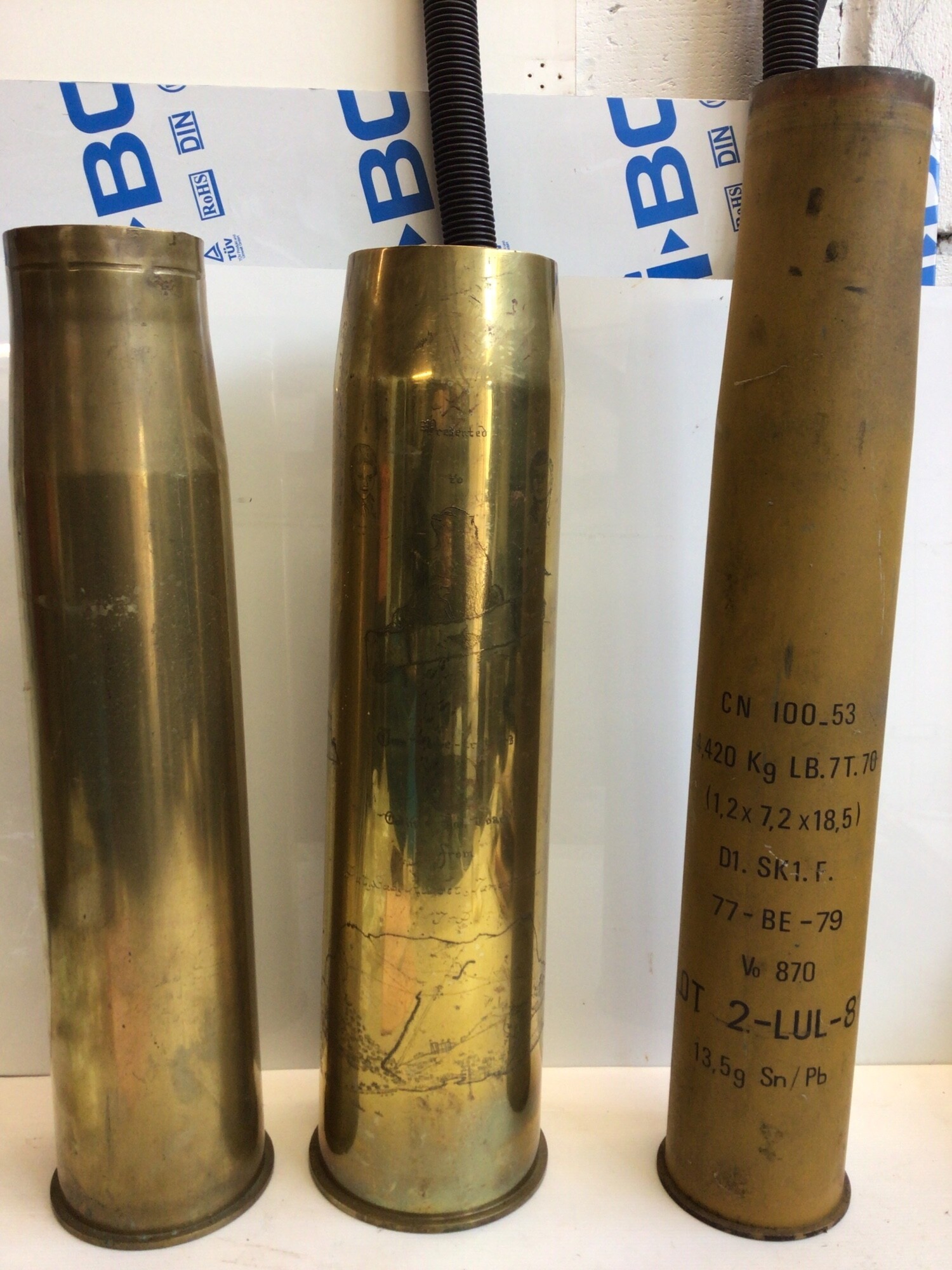 Three large Shell cases one with engraved decoration Two The Globe Trotters height 70cm (3)