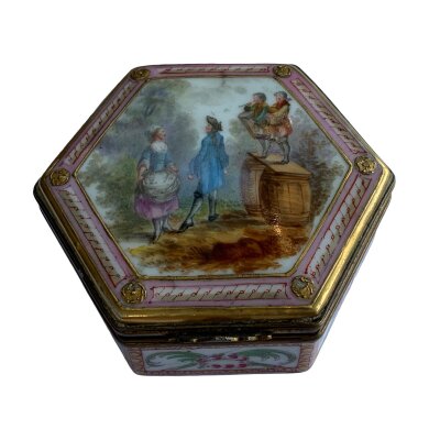 A small gilt metal mounted continental porcelain trinket box with hand painted romantic and floral scenes.