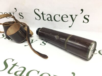 A brass and leather telescope, 87cm fully extended. No reserve