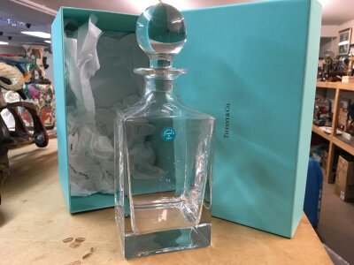 A boxed Tiffany glass decanter with detachable stopper
