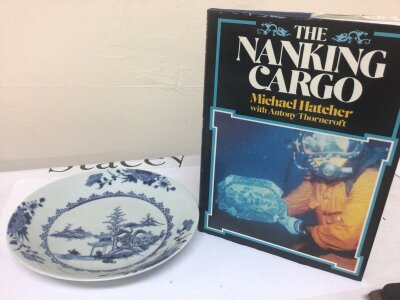 A Nanking Cargo porcelain The Chinese Export porcelain plate mid 18th century no obvious damage the base with sales sticker and sold with The Nanking Cargo book by Michael Hatcher.