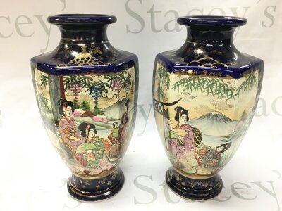 A pair of satsuma vases decorated with figures, 26cm tall. Crazing and chips to paintwork but no obvious damage or restoration