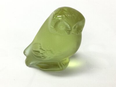 A Lalique frosted and clear lime green Nyctal owl paperweight. Approximately 6cm tall.
