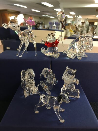 A collection of Swarovski Disney pieces including Bambi, Winnie the Poo, Owl, Thumper and others, all boxed with no obvious damage or restoration