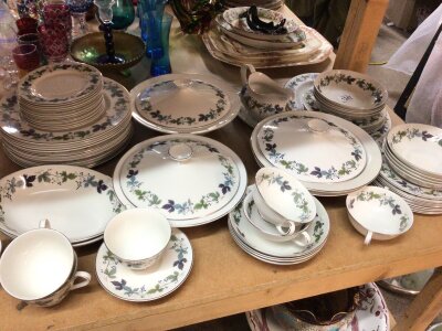A Royal Doulton Porcelain dinner service The Burgundy pattern. Comprising tureens cups sauces soup bols graduating plates dessert bowls sauce boat.