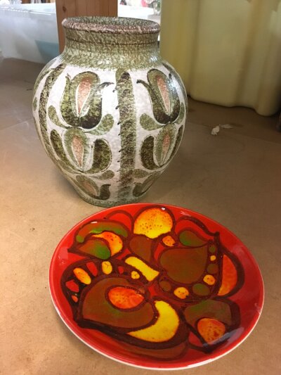 A Denby stoneware vase and a red Poole pottery dish