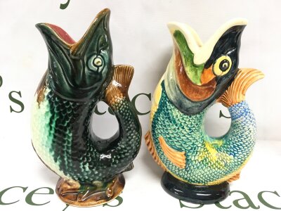 An early 20th Majorca Fish jug and a Dartmouth Devon jug (24cm tall),