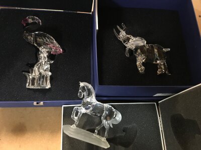 Three boxed Swarovski pieces including flamingo, bull elephant and horse