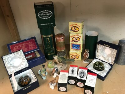 A box of assorted decorative pieces including Post Office Historical Miniatures, Border Fine Arts, Caithness, Coal miners lamp etc
