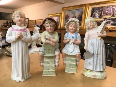 Four bisque Gebruder Heubach figures