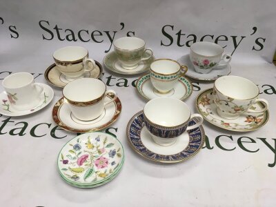 A small collection of cabinet cups and saucers including Royal Crown Derby, Wedgwood and other examples.