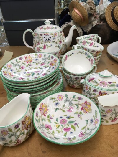 A Minton Haddon Hall tea set six cups saucers tea pot cream jug sugar bowl and more.