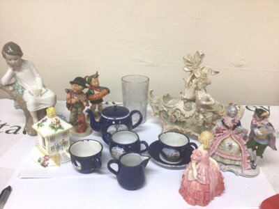 A Collection of ceramics a Lladro figure a young boy seated on a log an enamel child’s tea set Doulton figure and other ceramics and glass.
