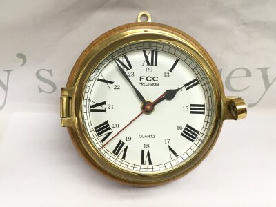 A Quartz brass cased ship's clock.- NO RESERVE