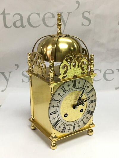 A brass lantern type clock, approx height 24cm.- NO RESERVE