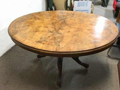 A walnut burr oval shaped inlaid design table, 135cm wide 70cm tall.- NO RESERVE