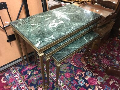 A nest of marble top tables. Largest 60cm wide 46cm tall 32cm long