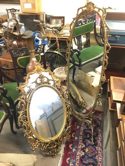 Four metal framed mirrors, largest 142cm tall