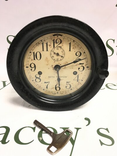 A vintage Seth Thomas ship clock.