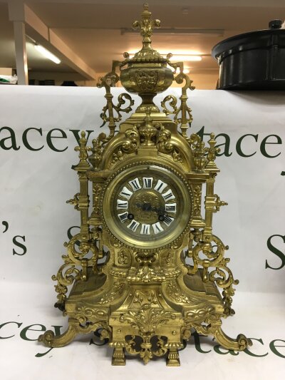 A 20th century gilt baroque style french mantle clock.