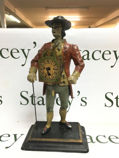 An antique peddler style clock.