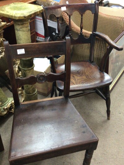 Five  19th Century British Vernacular chairs a traditional wheel back open arm chair comb back chair and three other chairs.