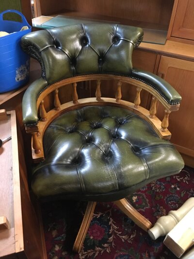 A green leather office chair