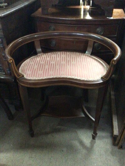 An Edwardian inland mahogany music stool.