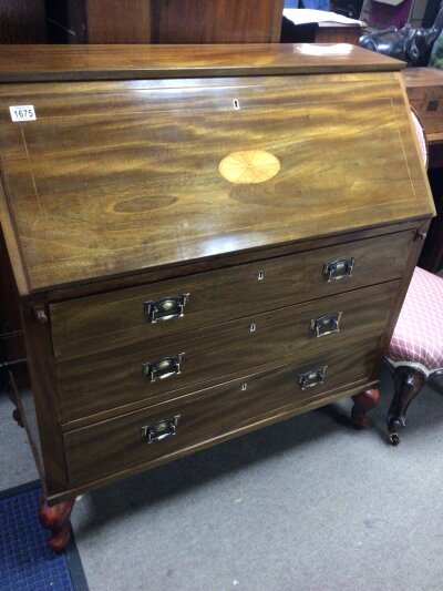 A Mahogany bureau the rectangular fall front enclosing a fitted interior above three drawers. NO RESERVE.
