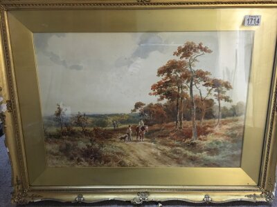A gilt framed watercolour depicting open landscape scene with figure on horseback. Signed Henry H Parker. Measuring 55cm x 38cm