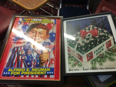 A collection of framed vintage adverts American including MAD
