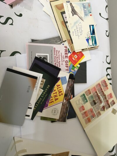 A box containing Pictorial unused Stamp books a stock books containing some Victorian and later Stamps and a collection of 1960s postal covers and other associated items.