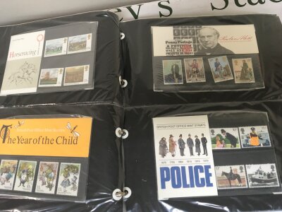 A Blue Stuart Album containing 1980s Presentation packs and some first day covers including 1978 FA cup finial cover