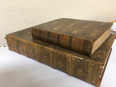 A large Family Bible leather bound and dated 1814 Old and New Testament with some hand written 19th Century family inventory. Also one other leather bound book The Wisdom of God displayed in the works of the Creation. dated 1816 with illustrations  (2)