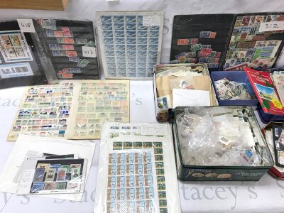 A large collection of assorted stamps including complete mint sheets.