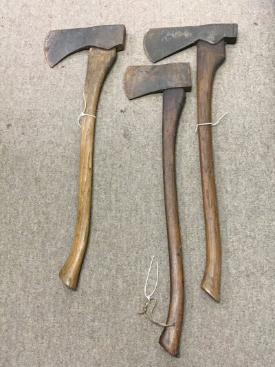 Three vintage axes including Elwell, approximately 90cm long