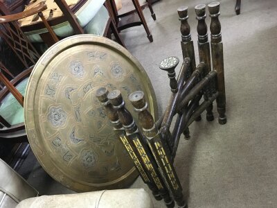 A folding Eastern card table with circular brass tray