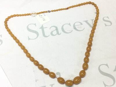 A Bakelite amber style necklace, 77.3 grams, 90cm long