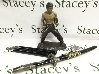 A Bruce lee figure (32cm tall) , nunchucks etc