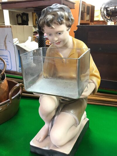A vintage plaster figural goldfish tank, 54cm tall