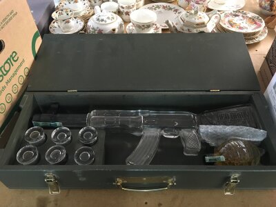A cased red army vodka AK47 bottle set in a fitted case