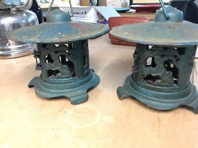 A pair of cast iron Japanese pagoda lantern. 
24cm wide and 19cm tall.